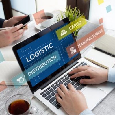 Two individuals collaborating at a desk with a laptop displaying logistics-related words like "LOGISTIC," "DISTRIBUTION," "CARGO," "MANUFACTURING," with floating graphics, sticky notes, a notebook, and a cup of tea visible.